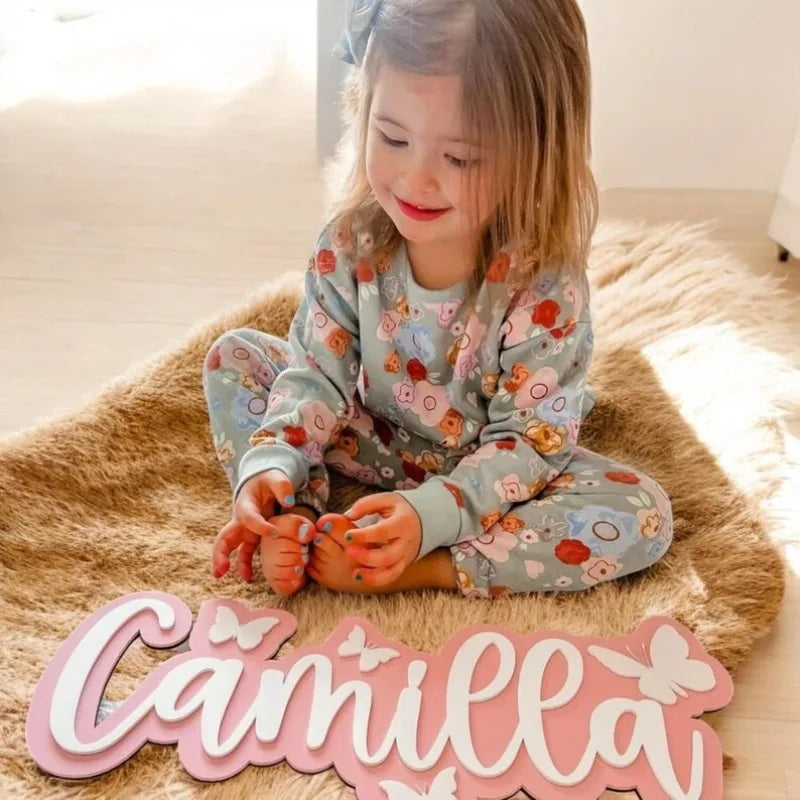 Wooden surname brand with butterfly pattern